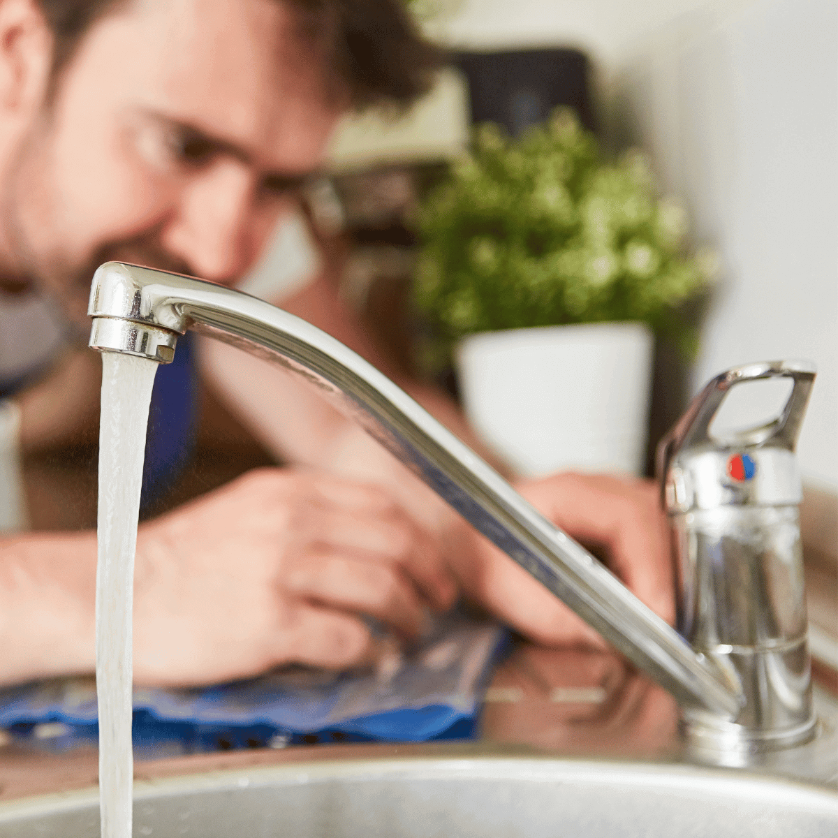 A plumber fixing tap