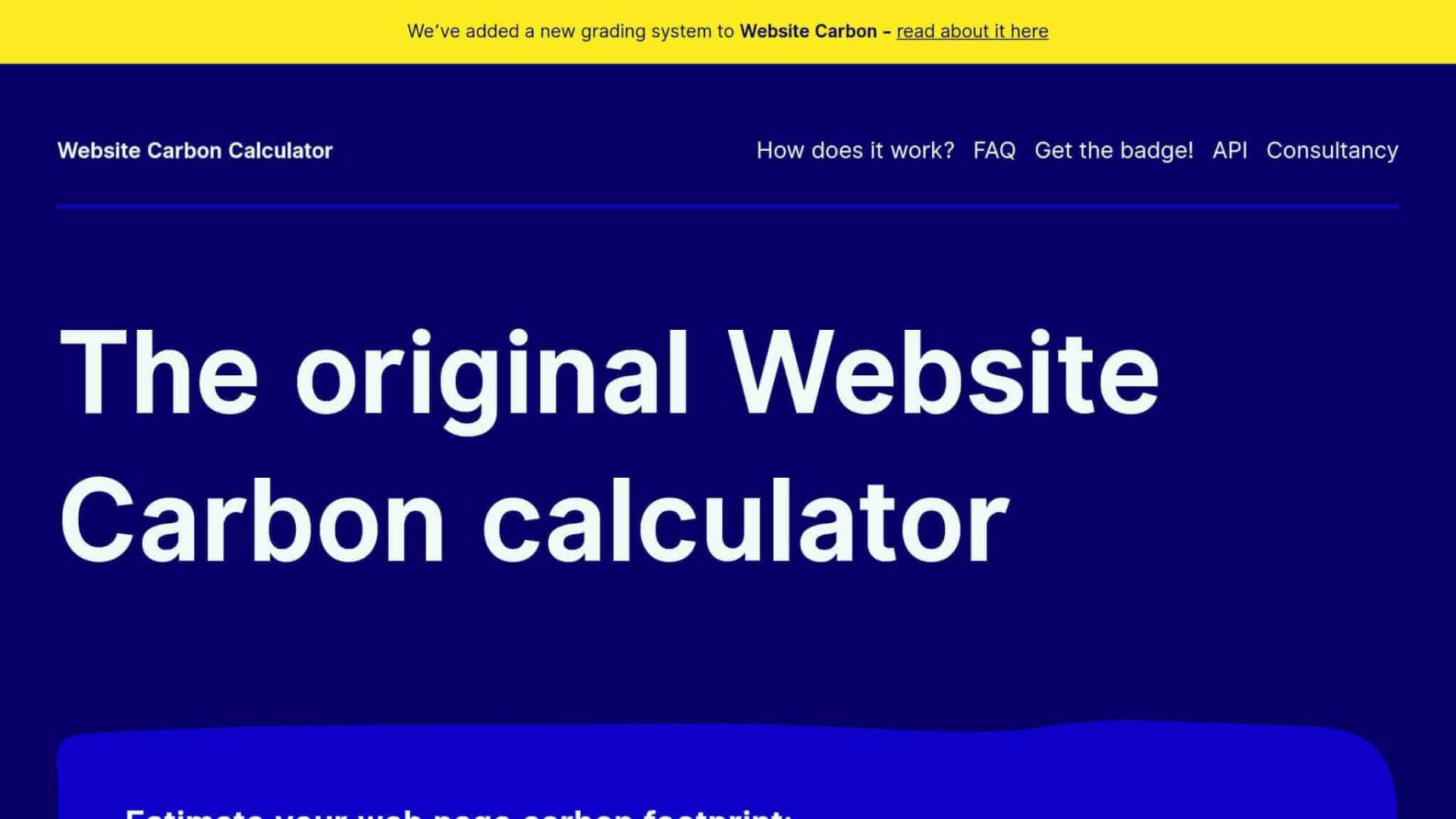 Website homepage for a carbon calculator tool, featuring a bold headline, navigation links, and a yellow announcement about a new grading system.
